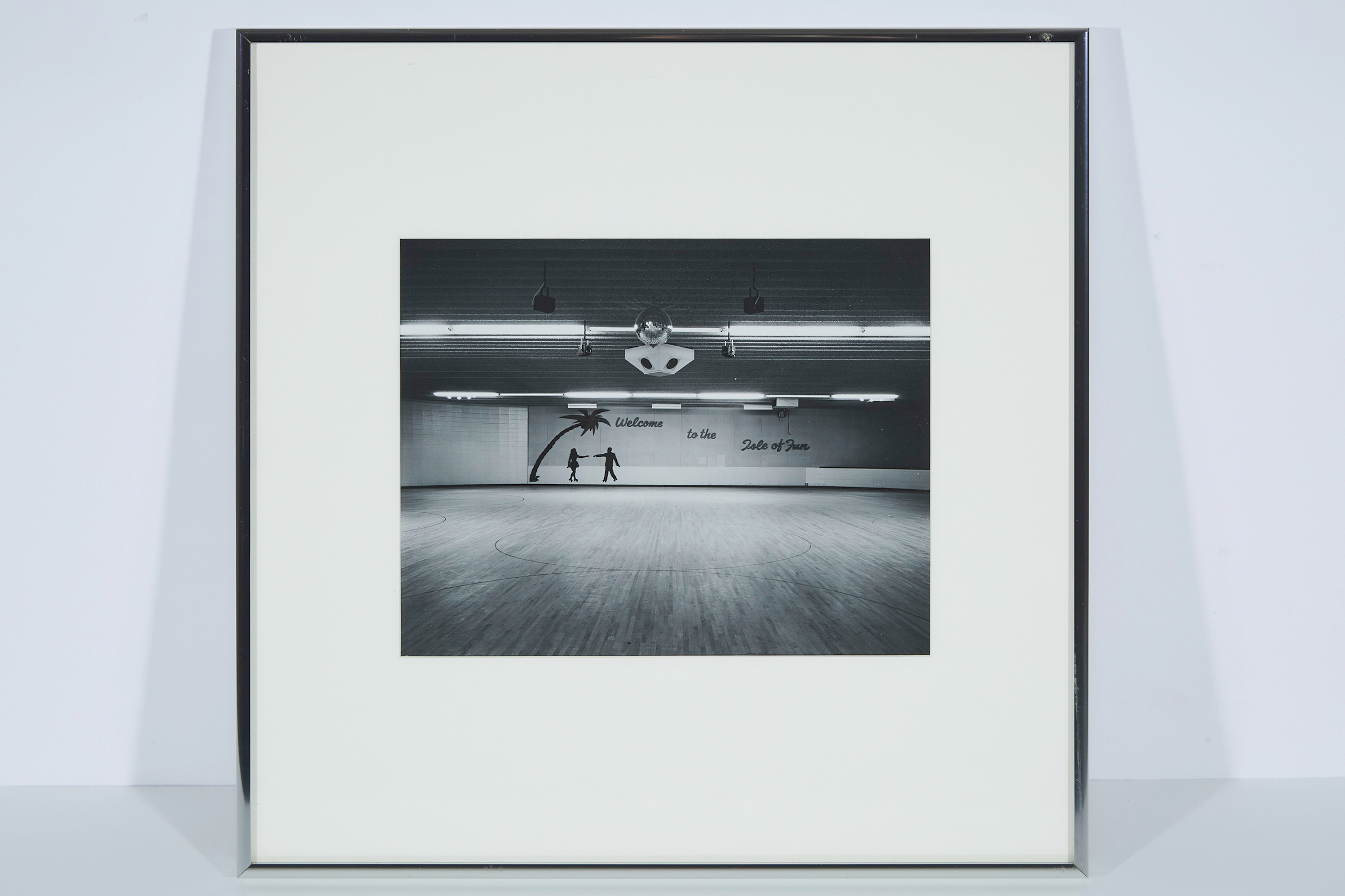     Lynne Cohen, RCA (1944-2014), Canadian Isle of fun skating rink, Grand Island, Nebraska, 1975. Contact silver print, 7.25 x 9.25&#8243;,
Yarlow/Salzman Gallery, Toronto;
Private Collection, Massachusetts

