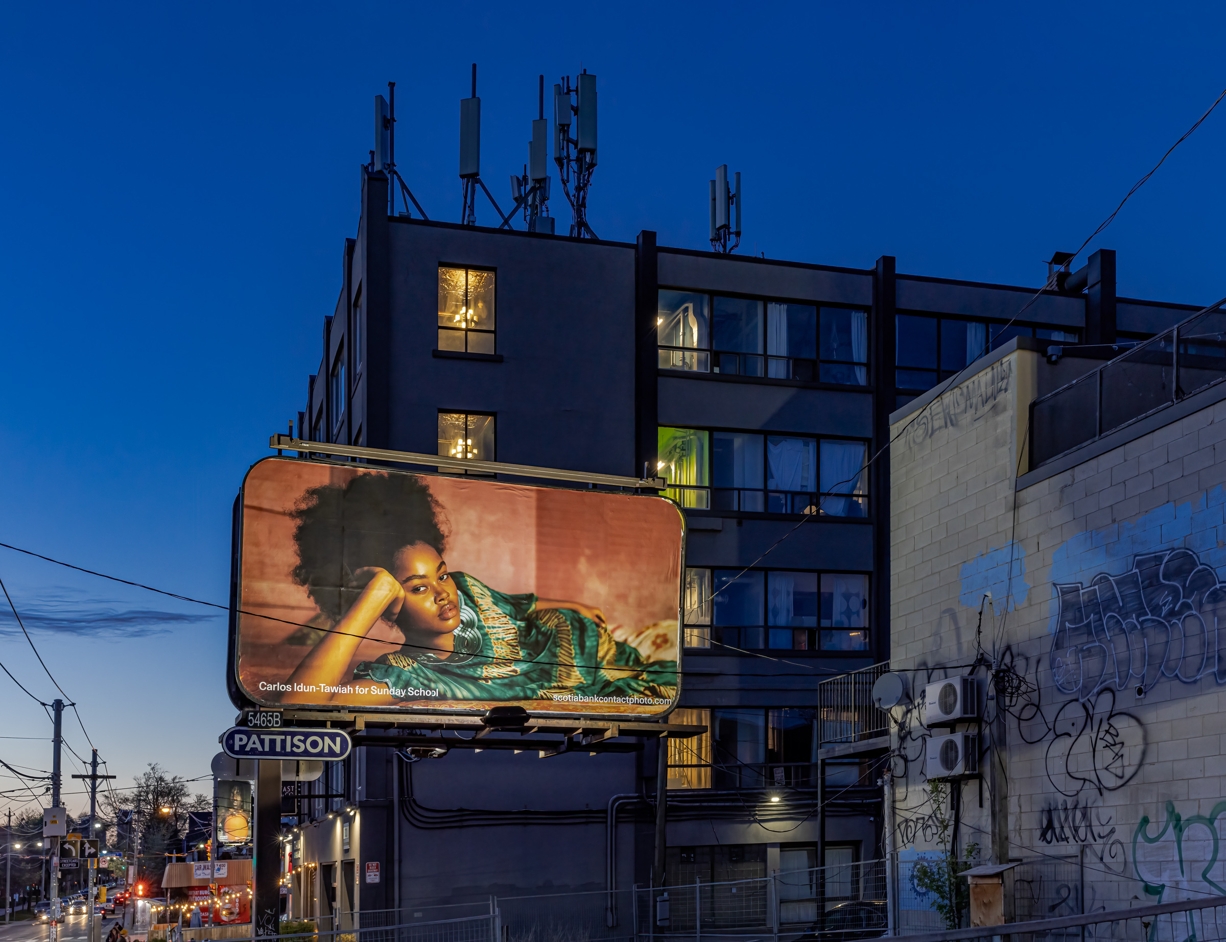    Sunday School, Feels Like HOME, 2023, installation view, billboards at Lansdowne Ave at Dundas St W and at College St, Toronto. Courtesy of the artists and Scotiabank CONTACT Photography Festival. Photo: Toni Hafkenscheid

