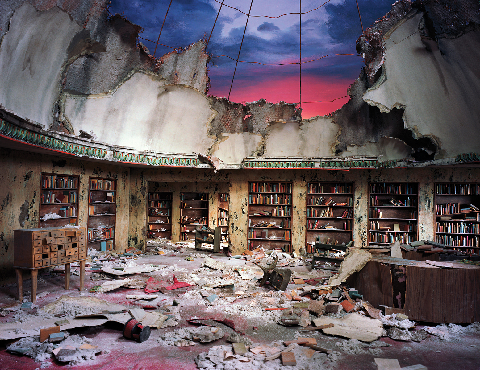     Lori Nix and Kathleen Gerber, Circulation Desk, 2012. Chromogenic Print, 48 x 62”. Courtesy of Bau-Xi Photo.

