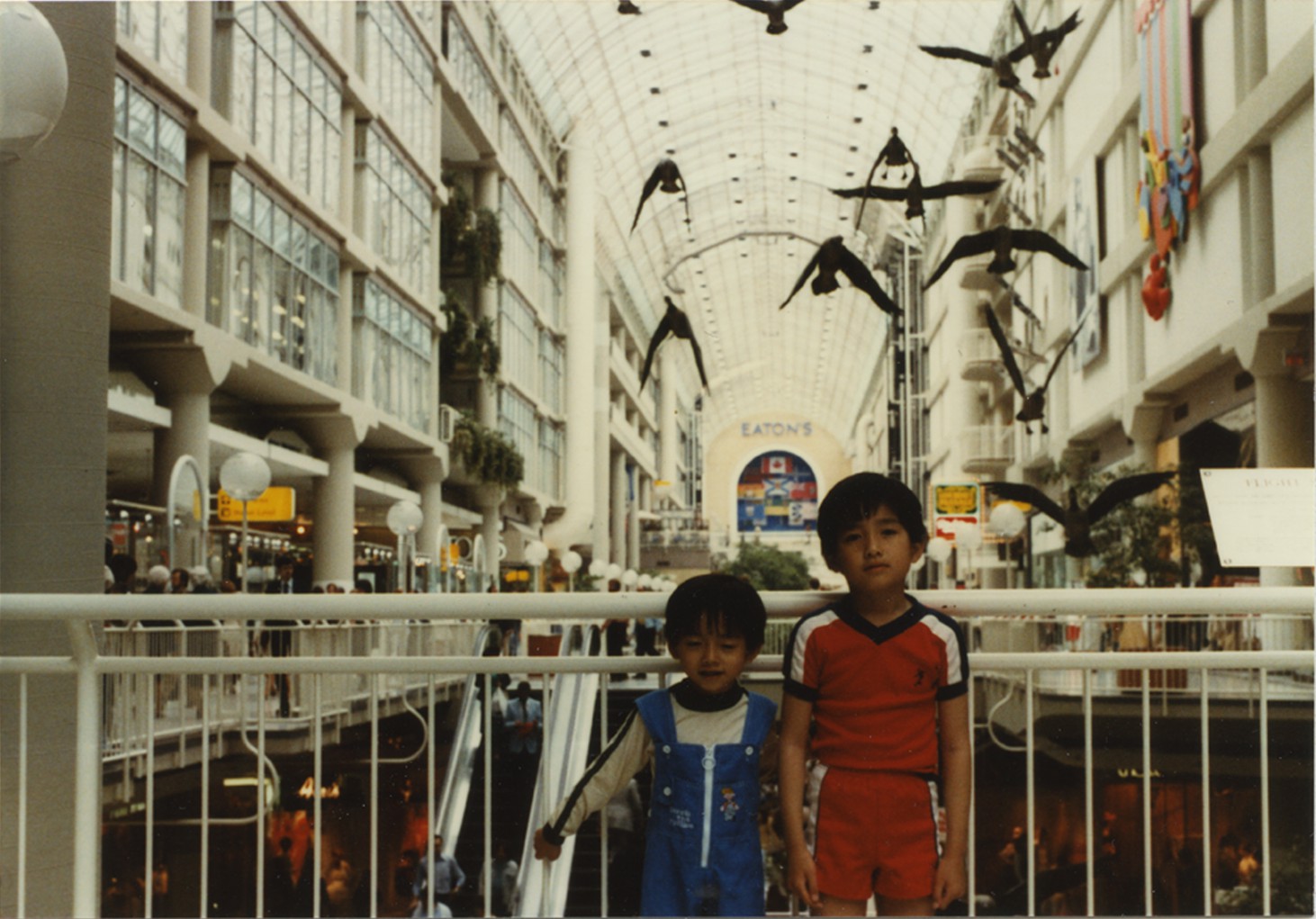     Luong Thai Lu, Binh and Hon at the Eaton&#8217;s Centre, Toronto, ON, June 1980. Dye coupler print. Courtesy of the Lu-Thai family.

