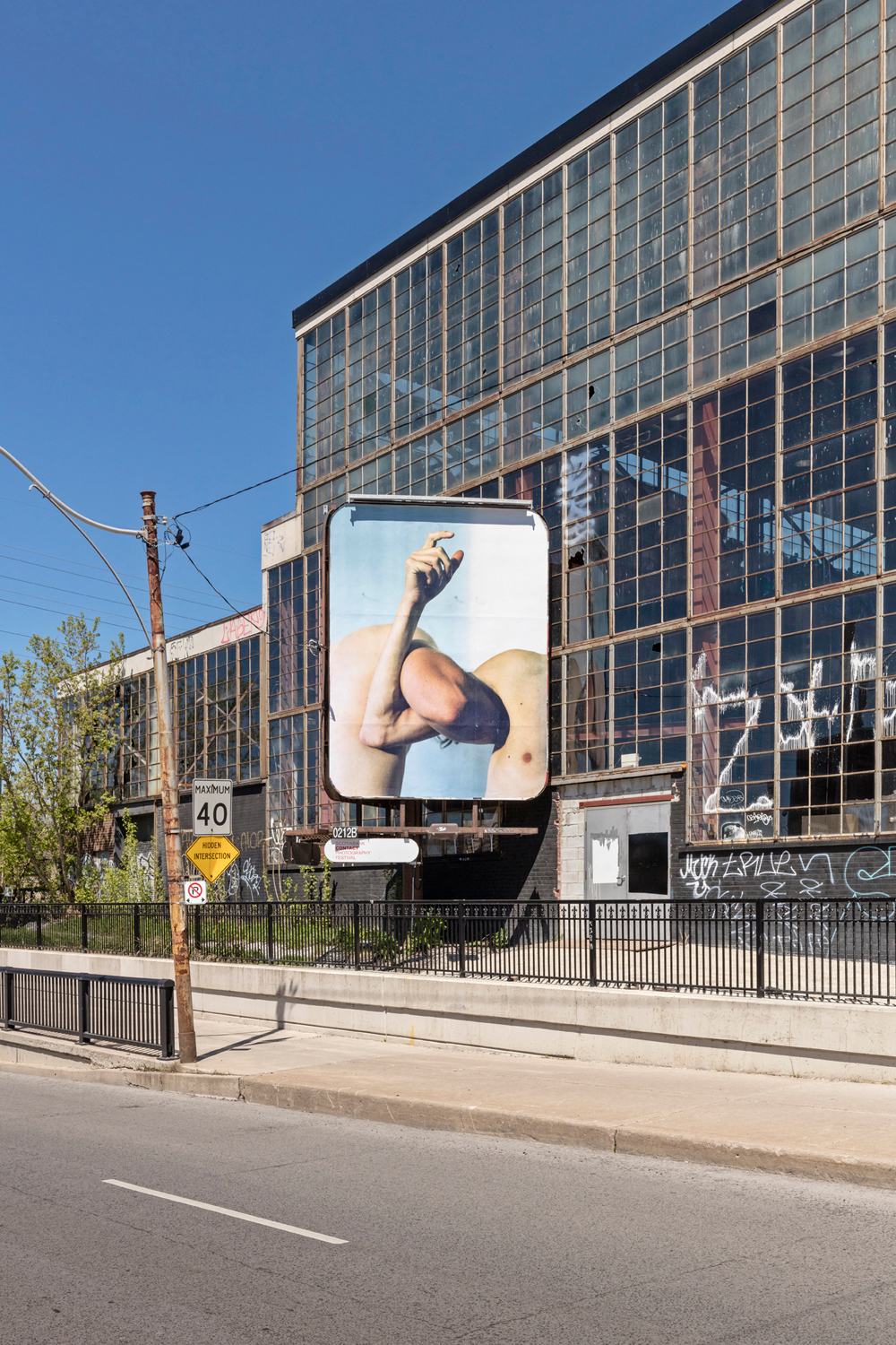     Steven Beckly, New Romantics, installation view of 4 billboards at Dovercourt Rd and Dupont St. 2017. Photo by Toni Hafkenscheid. 

