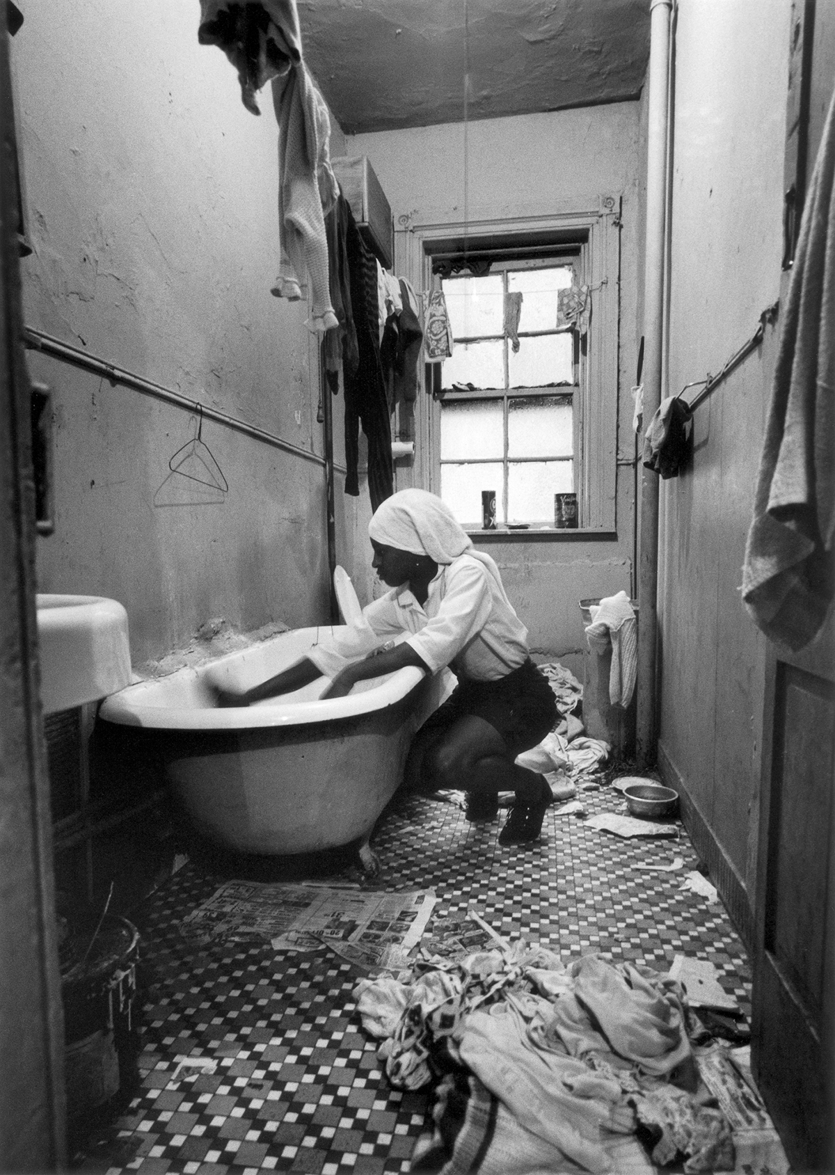     Gordon Parks, Rosie Fontenelle Cleans the Bathtub, New York, 1967. Gelatin silver print, 35.6 x 27.9cm. Courtesy of the Gordon Parks Foundation and Nicholas Metivier Gallery. © the Parks Foundation.

