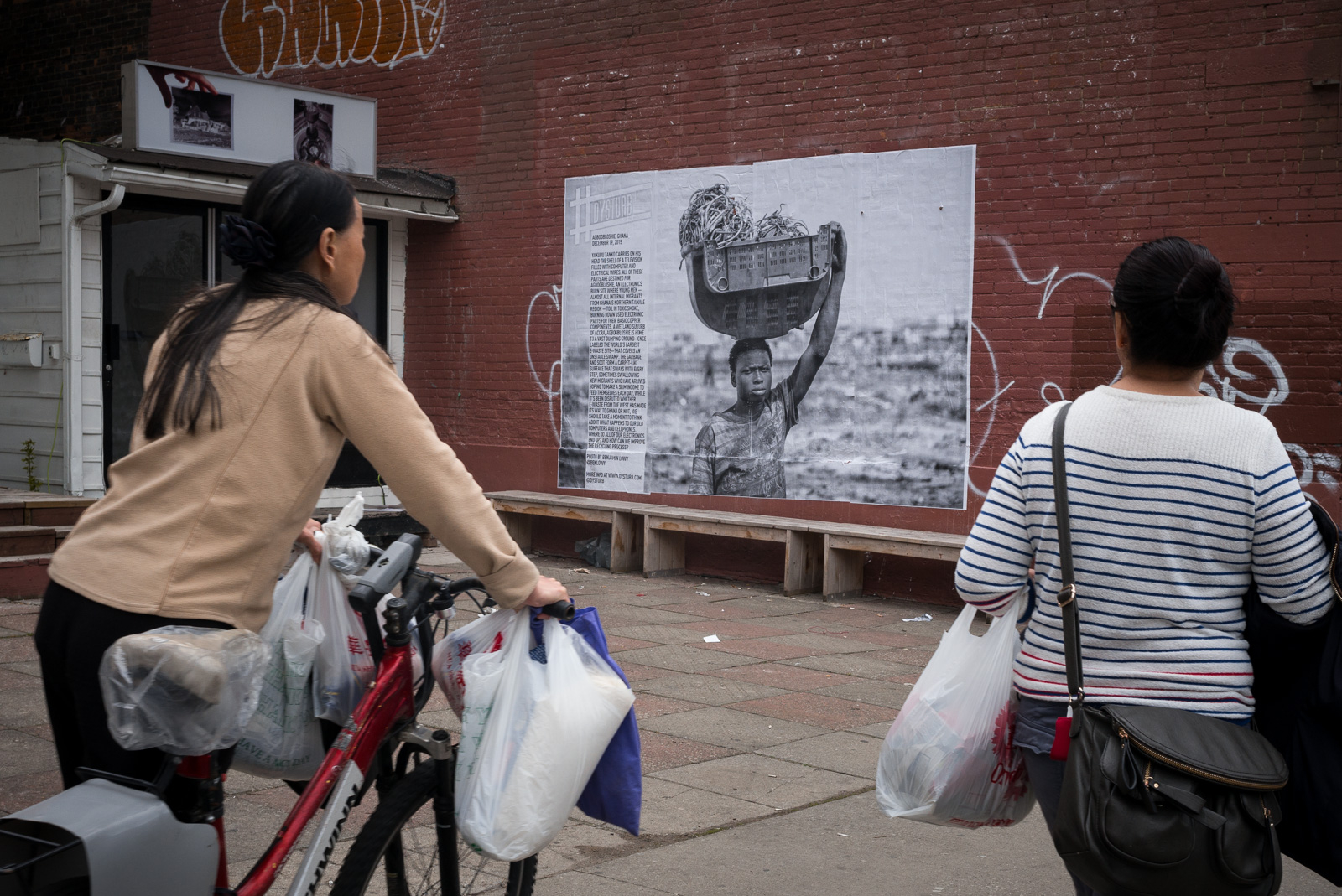     A photograph by Ben Lowy installed in front of 8eleven Gallery at 233 Spadina Avenue, Toronto. , Photo: Benjamin Petit
