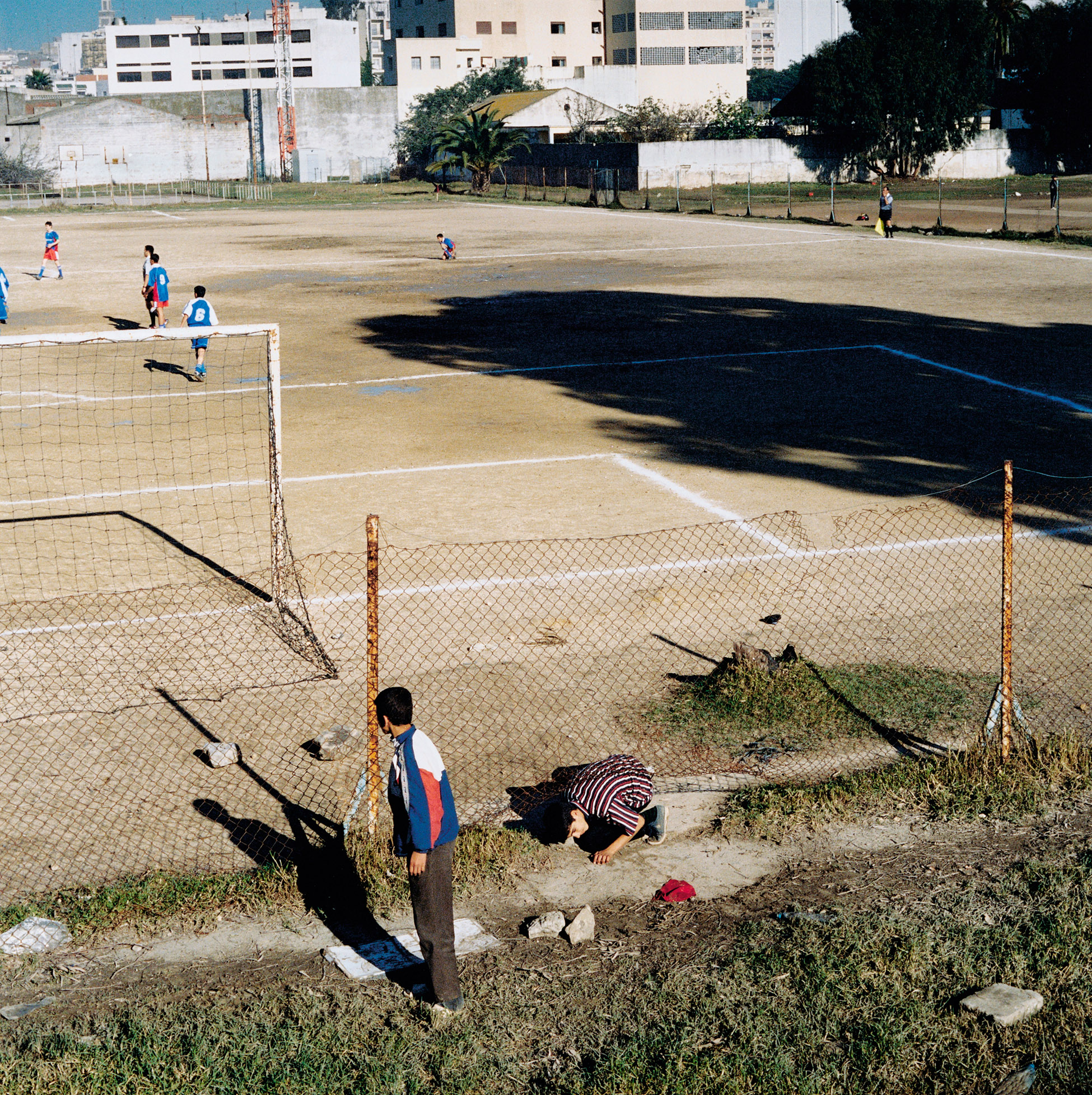     Yto Barrada, Hole in the Fence, Tangier, from The Strait Project, 2003 Courtesy Galerie Polaris

