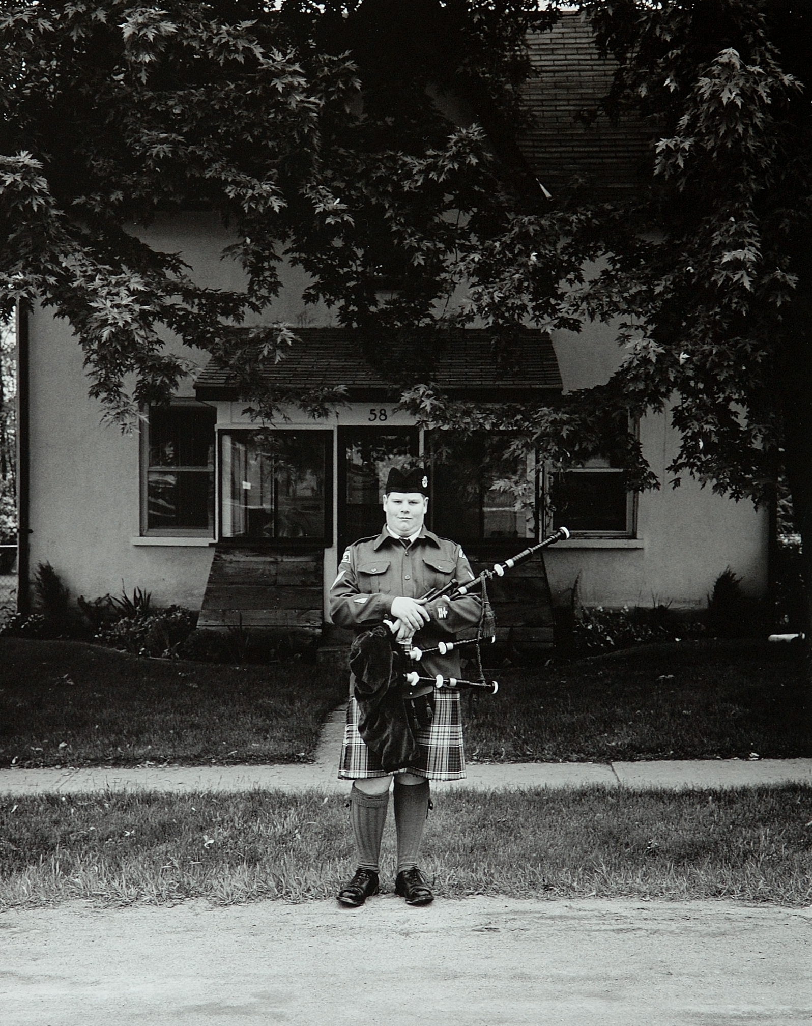     Tom Zsolt, Cadet with Bagpipes, 2003, Silver Print,   13.5

