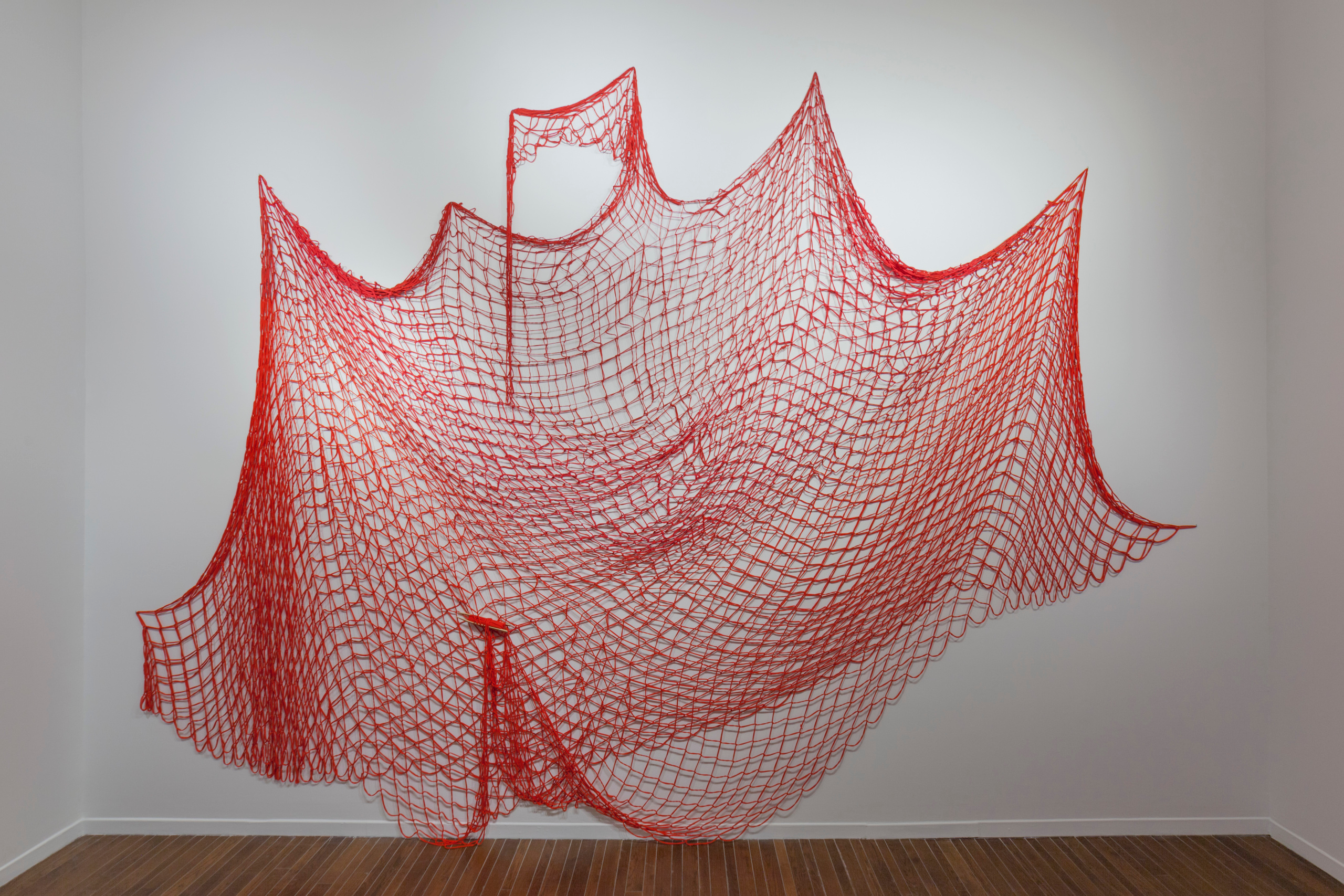     Installation view, Nadia Myre, Red Net (working title), 2019. Recycled cotton jersey.
Photo: Darren Rigo. Courtesy of the Textile Museum of Canada. 

