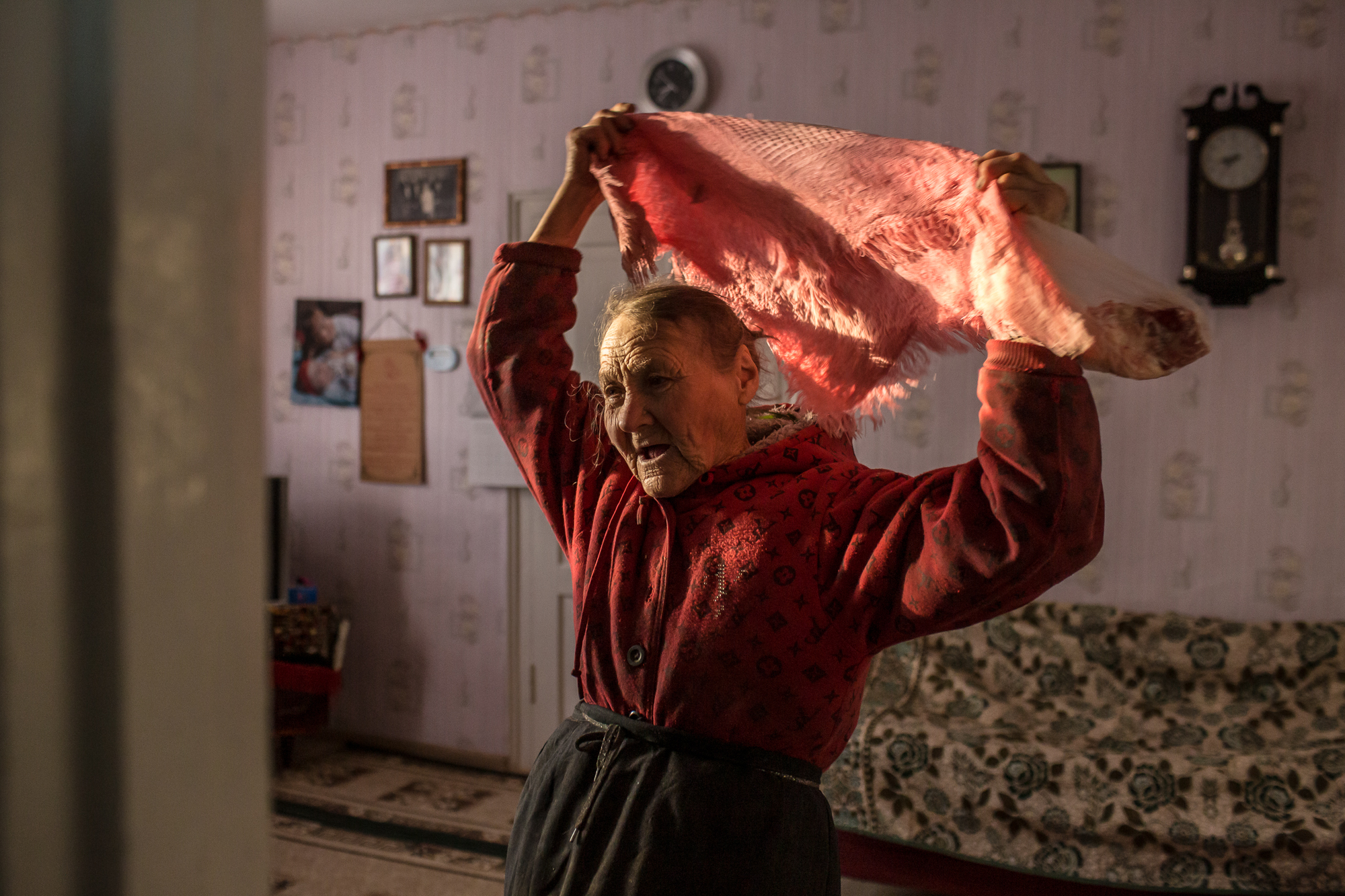     Olha Habro, 76, puts on a scarf in the living room on October 22, 2020 in Borshchiv, Ukraine. Olha Habro was born and grew up in the village of Borshchiv and cooks very tasty borshch with beans. I took this photo for the story about borshch for the NYTimes. 

Oksana Parafeniuk is an independent photographer based in Kyiv, Ukraine. 
In addition to her personal projects, Oksana has worked with such international media and organizations as The Washington Post, The New York Times, MSF, UNHCR, Save the Children and others. Oksana co-leads the Women Photograph Kyiv Chapter in Ukraine. 

Instagram: @oksana_par

Oksana.paraeniuk@gmail.com

www.oksanaparafeniuk.com, The Journal_Color Theme
