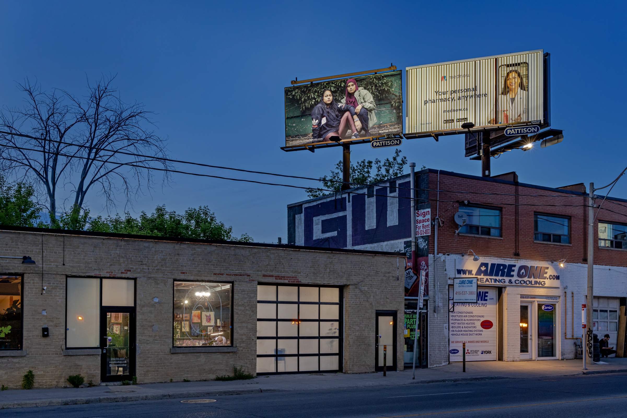     Mahtab Hussain, Tajvin Kazi and Rishada Majeed, 2021, from the series Muslims in America (ongoing). Billboard installation on Dupont St near Dufferin St, Toronto, 2022. © Mahtab Hussain, courtesy of the artist, Chris Boot, and CONTACT. Photo: Toni Hafkenscheid

